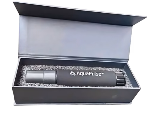 Black AquaPulse hydro-massage hose nozzle with foam grip lying in an open grey gift box
